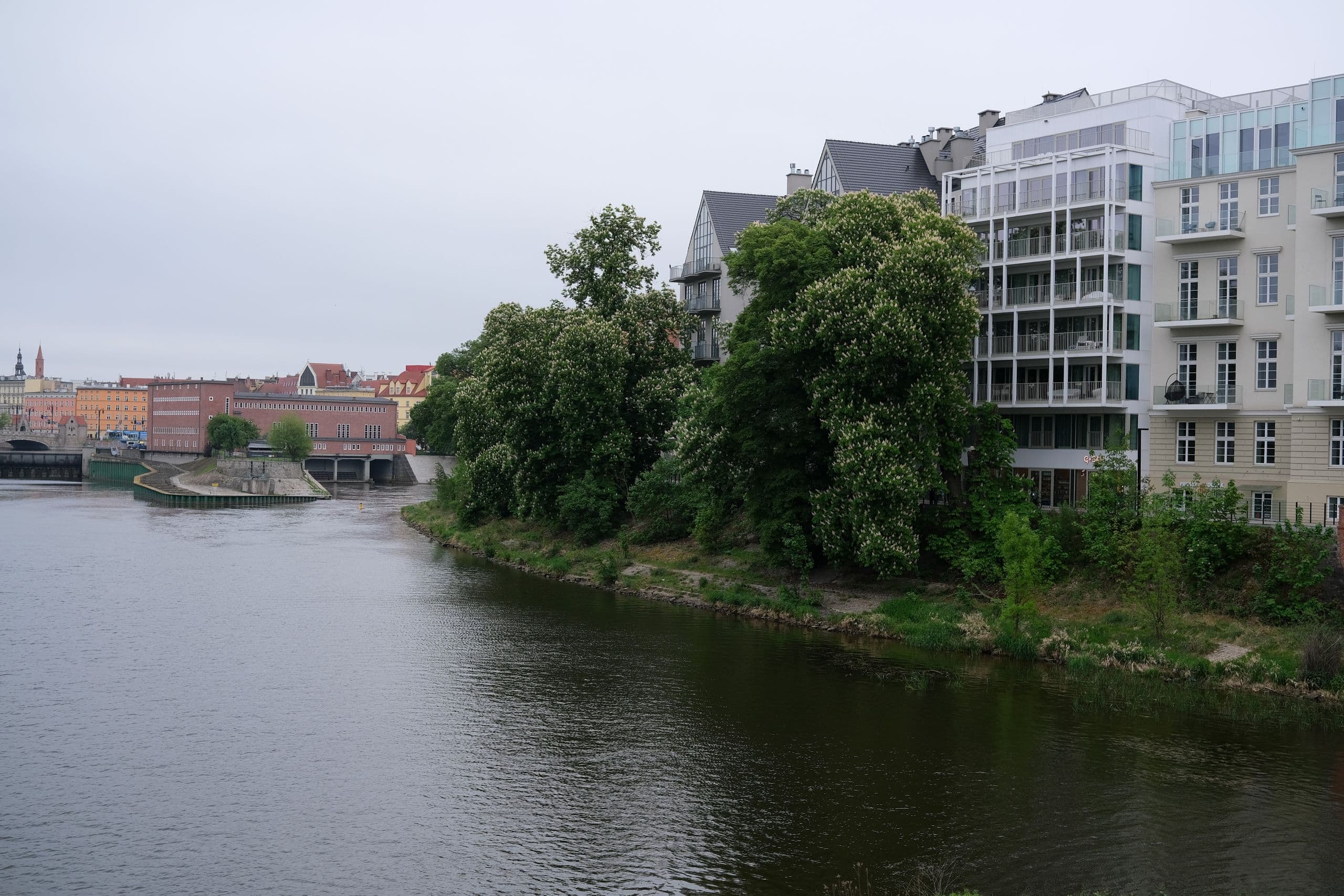 An apartment building beside a river